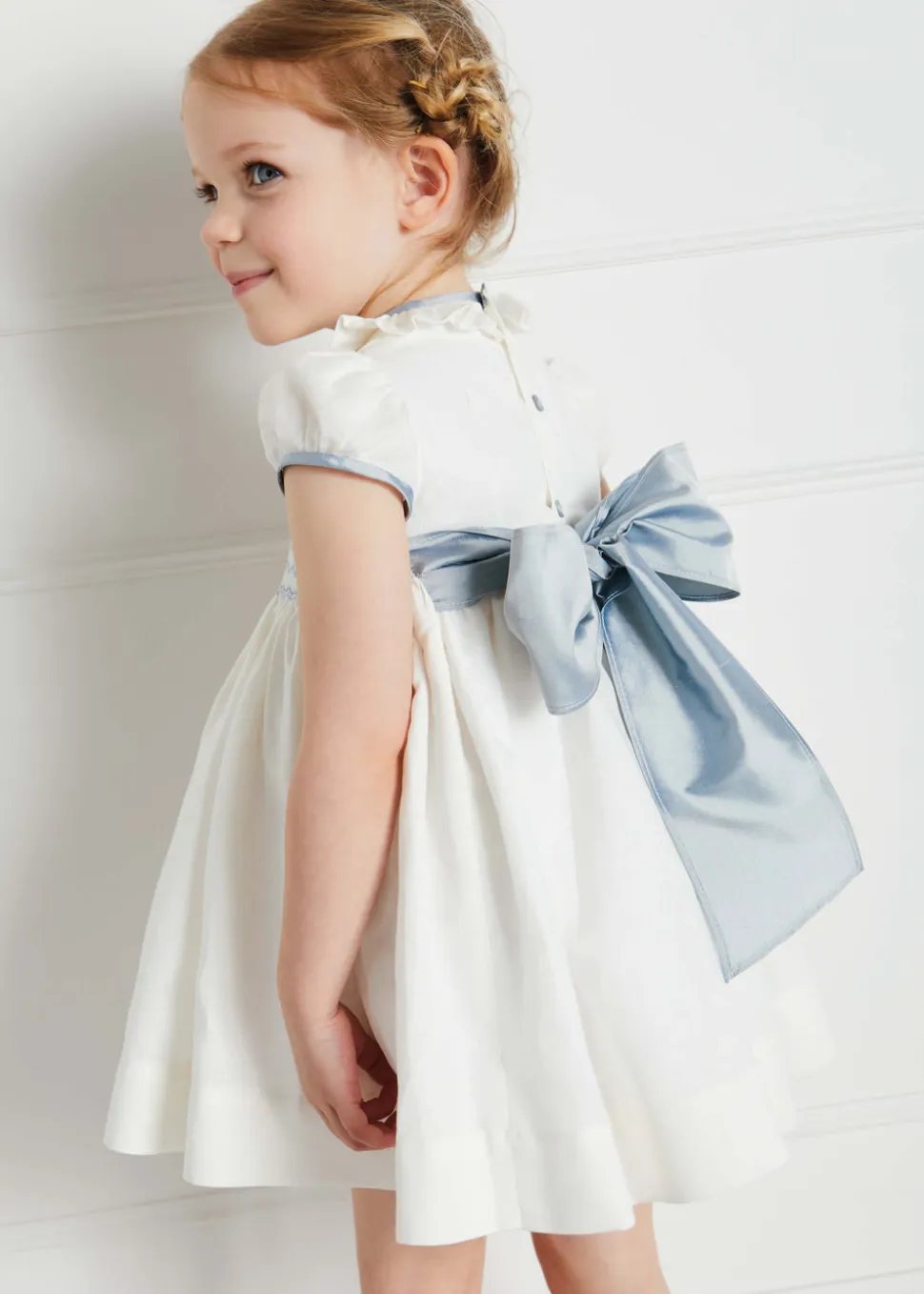 Hand Smocked Occasion Dress in Ivory with Blue Details